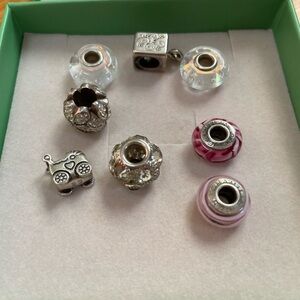 Mix of Pandora and Camilla charms.. Sterling Silver and color designs